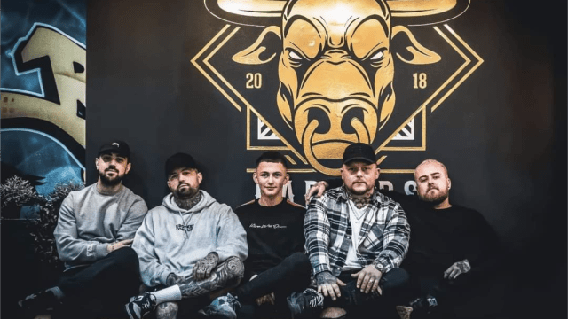 Jay, Eadon & Sam sat with each other in front of the bullhouse logo